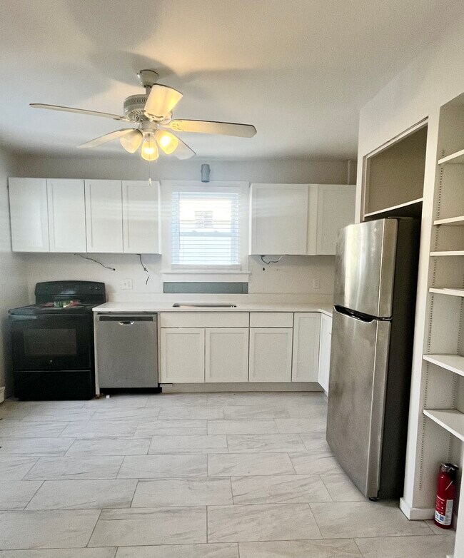 Kitchen renovation almost complete!d New cabinets and beautiful tile floor