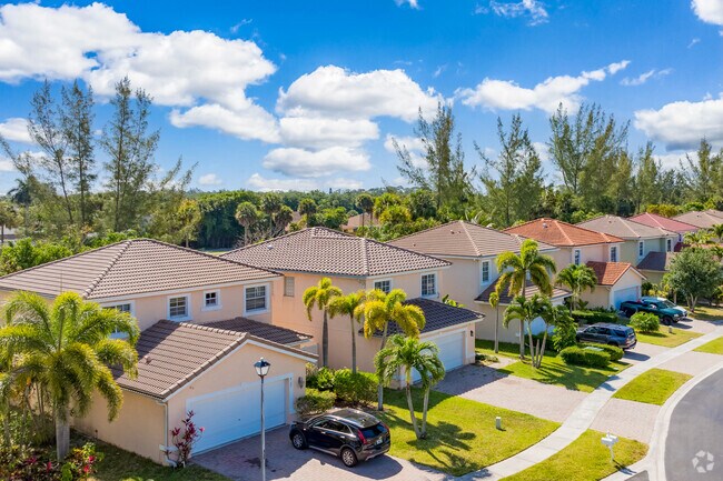 Luxurious charm with Mediterranean homes in a gated community in Royal Palm Estates.