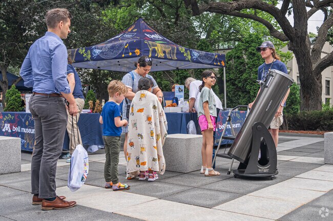 Visitors can examine the sun through a telescope at Rock the Cradle in Whittier.