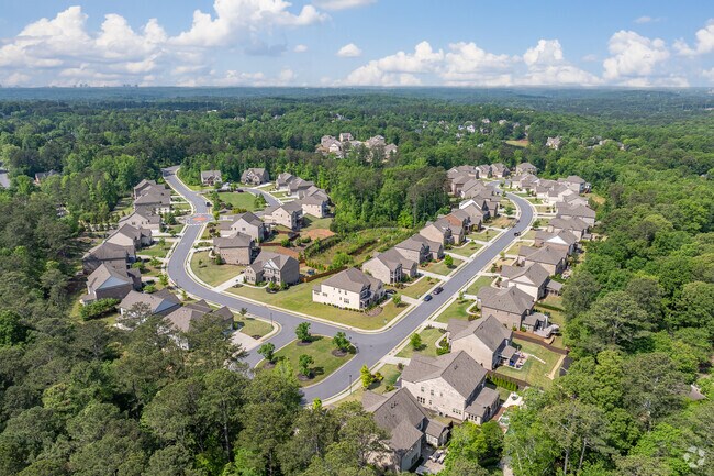 A peaceful cul-de-sac showcases the organized layout and elegant architecture within Nesbit Lakes.