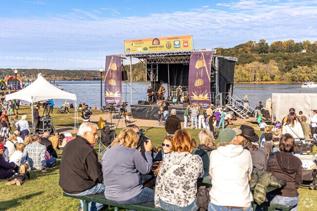 Attendees enjoy the music at the performance stage at the Stillwater Harvest Fest.