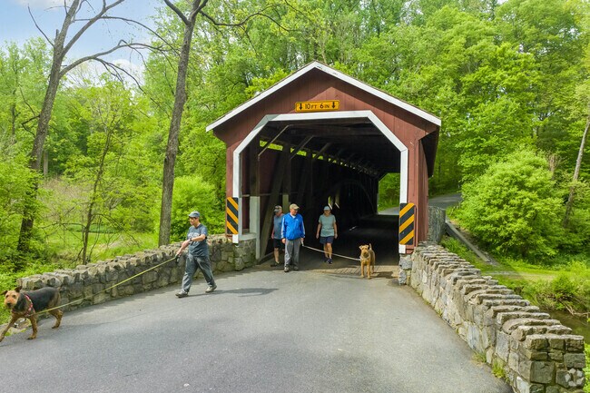 Take a stroll with friends  through the covered bridge at Lancaster County Central Park.