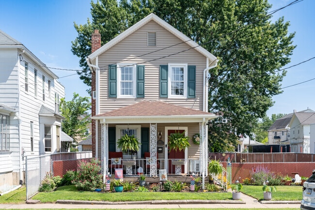 This updated Stick home brings the neighborhood to life with its lovely garden in Luzerne.