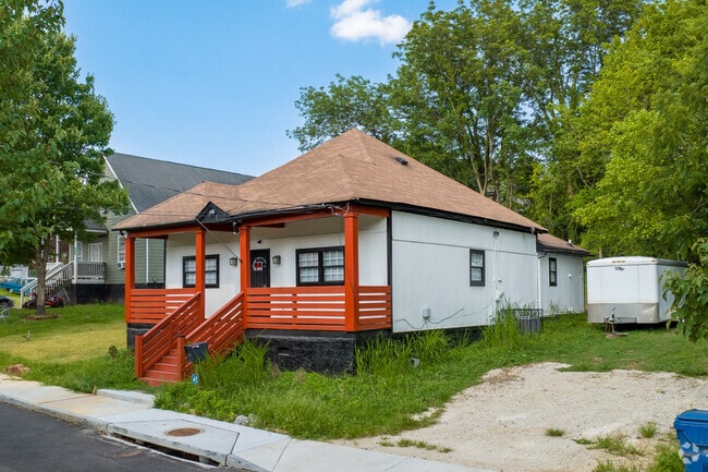Vine City houses, like this bright bungalow, often have covered porches for residents to enjoy.