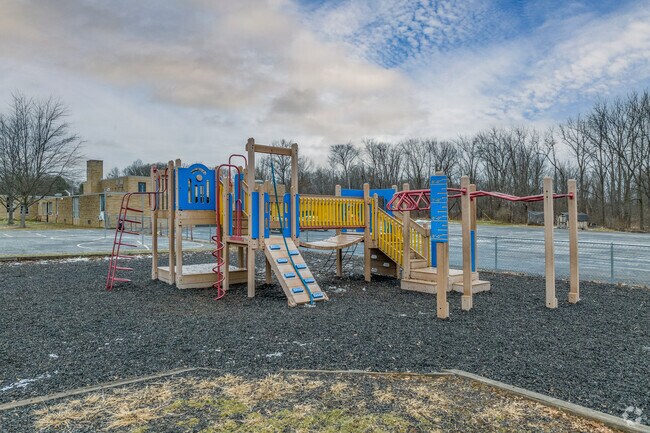 Students play on a large jungle gym at recess at Nolley Elementary.
