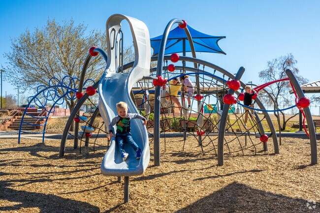 Kids love the large playground at North Domingo Baca Park, located just across Paseo Del Norte Boulevard from the neighborhood.
