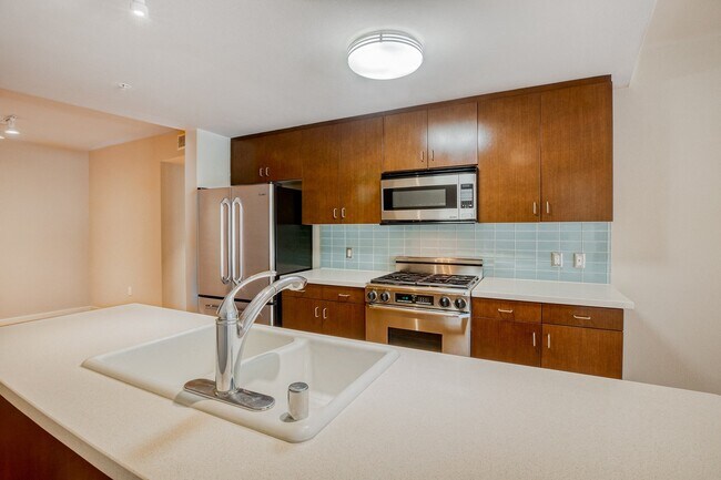 Kitchens are complete with Caesarstone countertops and decorative backsplash
