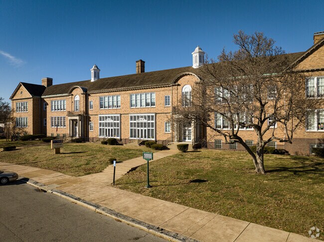 Woerner Elementary School is set back from the street with beautiful trees in front.