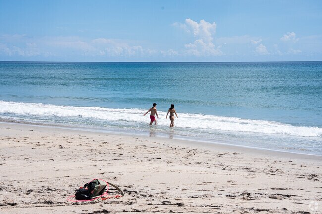 Gentle waves and soft sand make this shoreline a family favorite.