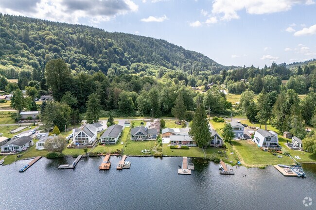 Find your waterfront dream home surrounded by the evergreens in Lake McMurray.