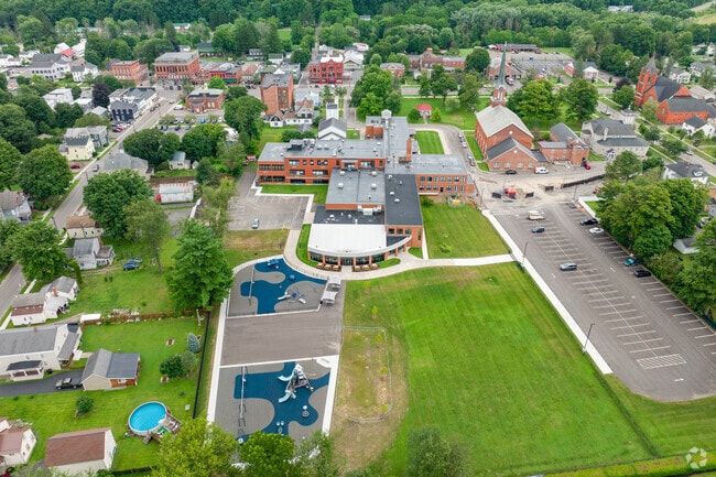 Homer Elementary School features a small green space for students.