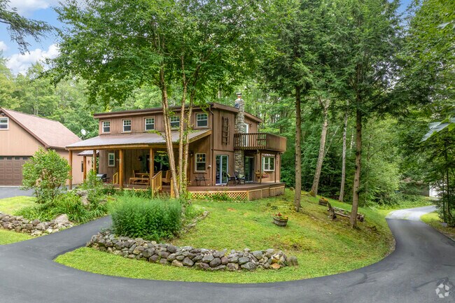 Many properties embrace scenic mountain vistas with spacious porches and hot tubs.
