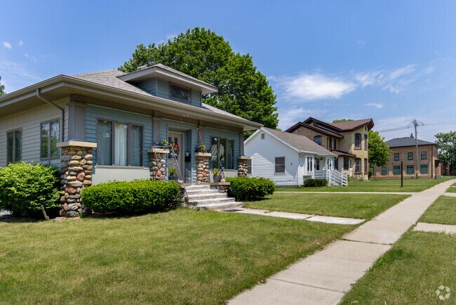 A Craftsman bungalow leads this row of Elkhorn homes, followed by ranch and two-story styles.