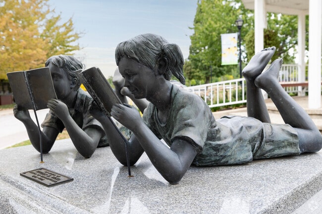 Sculptures celebrating literature stand outside the Brookdale Library in Brookdale.