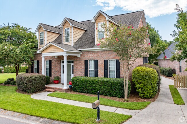 A Cape-style home in Masonboro Forest features vibrant colors and brick construction.