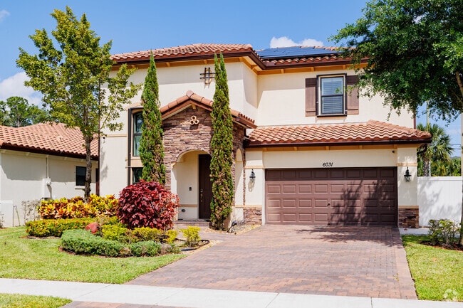 Mediterranean home with beautiful landscaping in Ranchette.