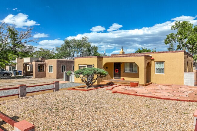 Highland Business neighborhood has single-story Pueblo-inspired homes lining gridiron streets.