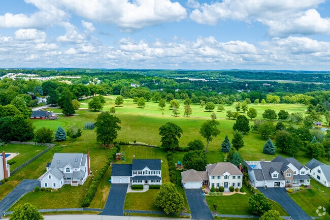 Homes on Saybrook Way line the first hole fairway at Pakachoag Golf Course.