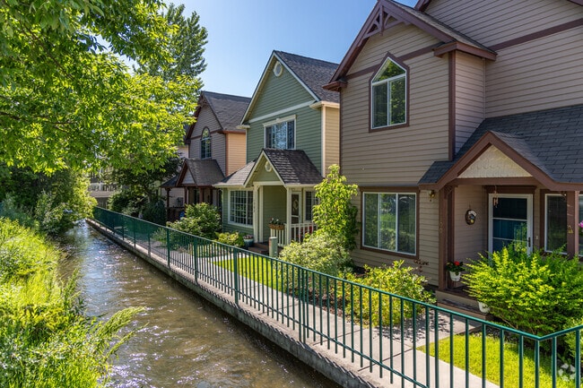 These Victorian revival homes feature a creek right in their front yard.
