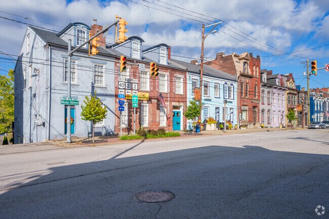 Various sized old town-style homes line Main Street in North Wheeling.