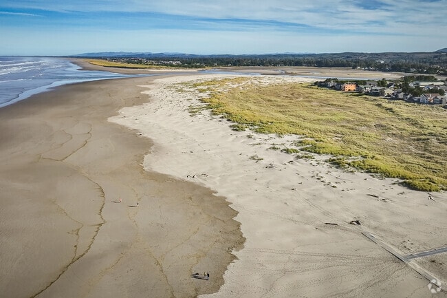Families with love exploring the miles of shoreline at Woodland Park.
