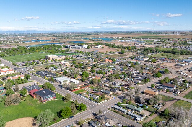 Clayton Park unfolds from above—tree-lined streets, cozy homes, and a tight-knit charm nestled just minutes from downtown Greeley.