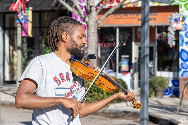 Experience the vibrant atmosphere of live music as talented musicians perform captivating melodies on the bustling streets of the College Heights area, filling the air with rhythm and energy.