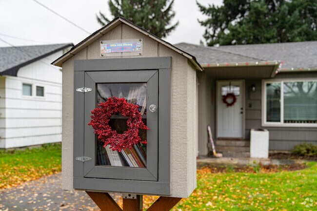 A small neighborhood library provides easy access to books in Olympic East.