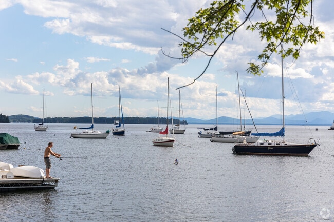 A fisherman tries his luck in the waters of Lake Champlain, Burlington.