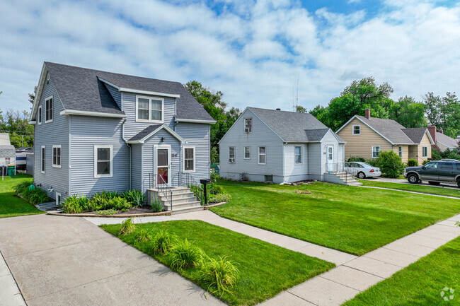 The lawns are well manicured with lush green grass in the neighborhood of Sukut's.