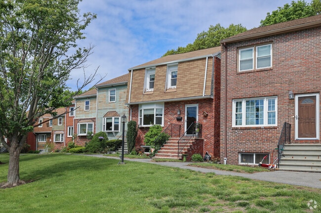 Sun drenched townhouses define the facade of Vinnin Square, adding warmth and charm to the neighborhood.