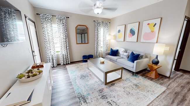 The Hub includes a a spacious living room with natural light and private patio/balcony access.