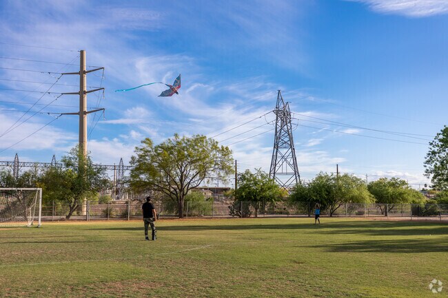 A father and son fly a kite at Brandi Fenton Memorial Park near Rillito.