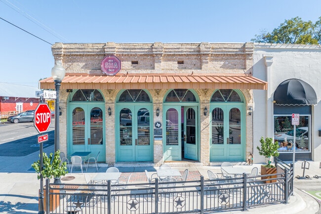 AR•U•SHA coffee shop, a historic charm with delicious tacos and a cozy ambiance.