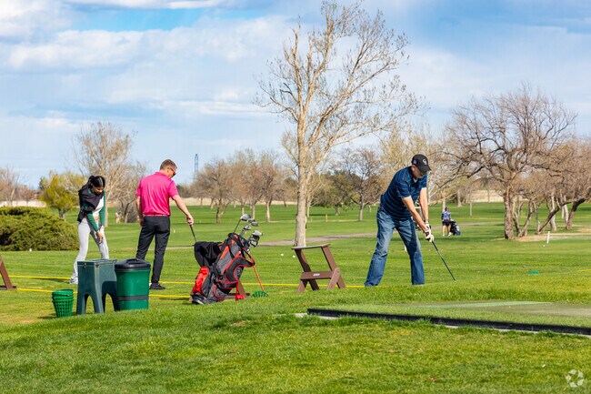 Practice your swing on the driving range at Aurora Hills Golf Course in Highline Villages.