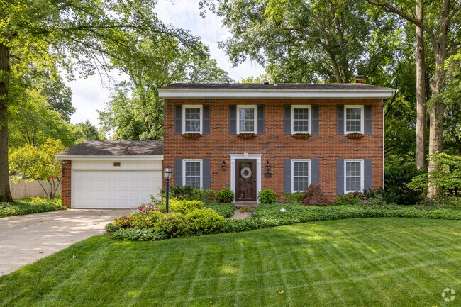 This brick Colonial separates itself from its neighbors in Greenbrier Farms.