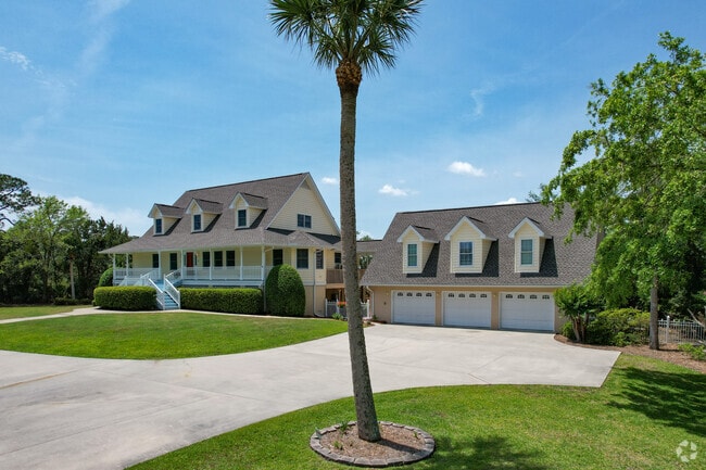 Larger homes in Dock Junction feature multi-car garages and large manicured lawns.