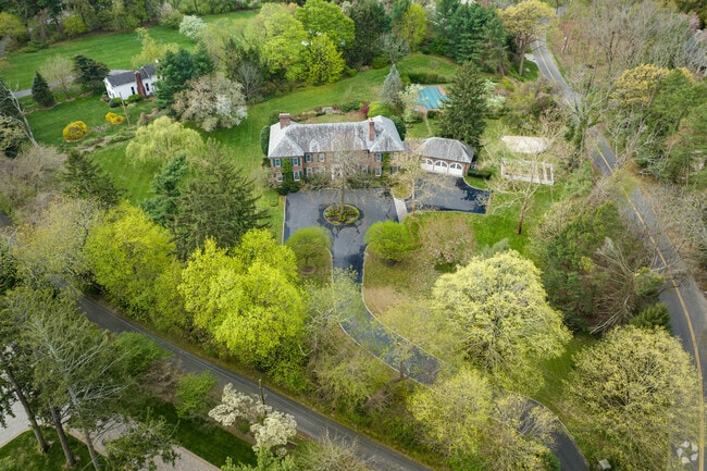 A perfectly manicured mansion sits in Upper Brookville.