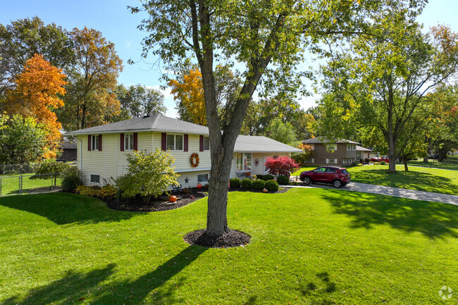 Beautifully maintained front garden with this split level ranch style home in Centerhurst.