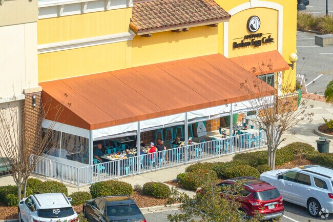 Enjoy lunch indoors or on the patio at Another Broken Egg Cafe in The Pavilion near Coraci Park.