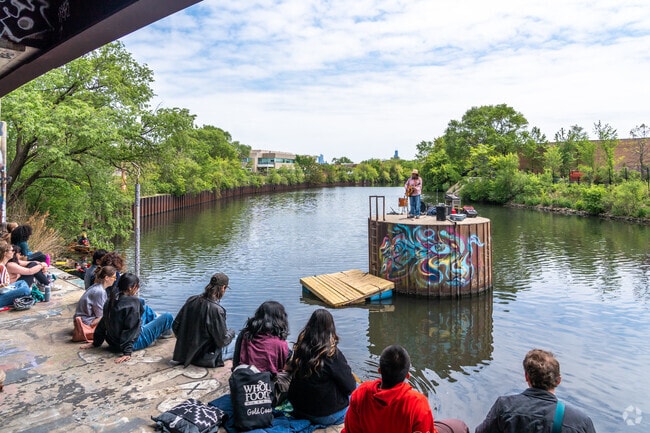 Patrons hang out and picnic under the bridge during the Secret River Show in Roscoe Village.