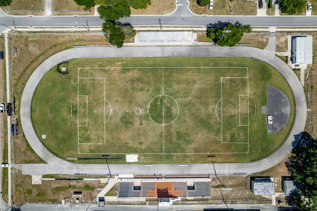 Aerial down view of the track and soccer field of Umatilla High School is a public school located in UMATILLA.