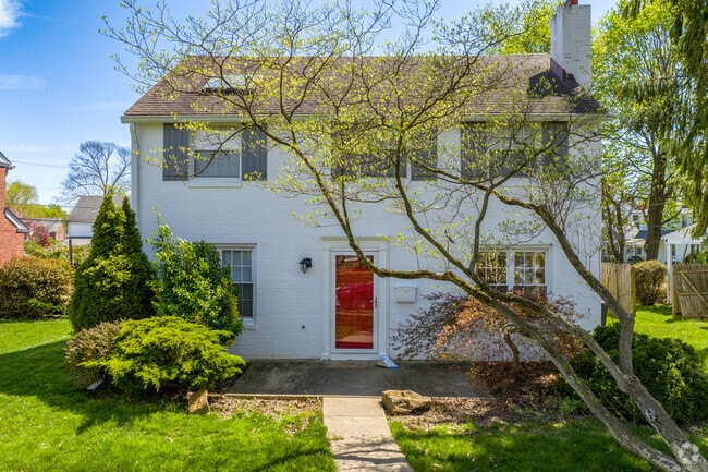 Colonials stand out with brightly colored front doors and big backyards for kids and pets in Ardmore.