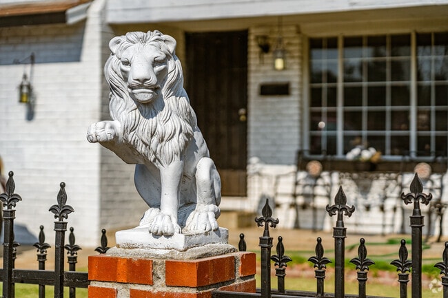 The lion sits on guard as members of the Northgate community walk on by.