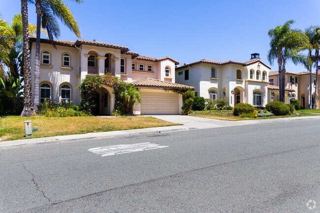 Landscaped streetscapes and trails surround rows of homes in Rancho Carrillo.
