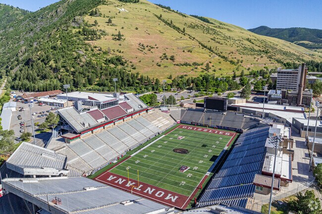 Washington-Grizzly Stadium offers epic grid-iron matches with mountain views.