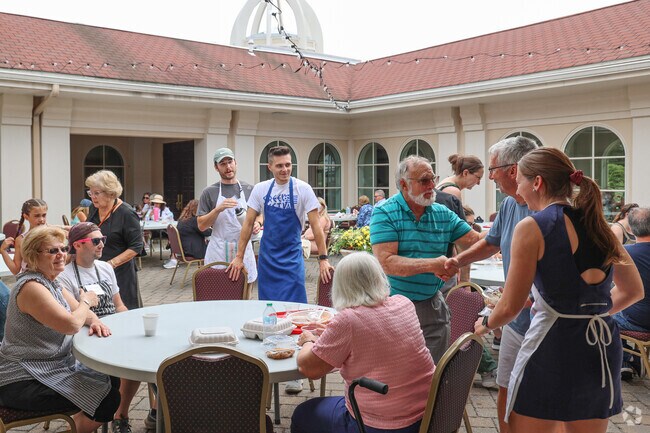 Friends gather for great food at the Andover Greek Festival.