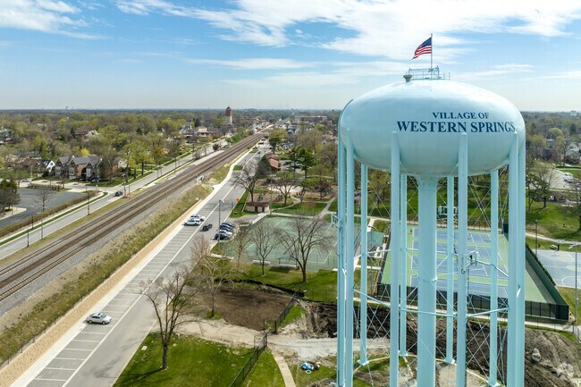 The Western Springs Water Tower is visible in the park near Burlington Avenue.