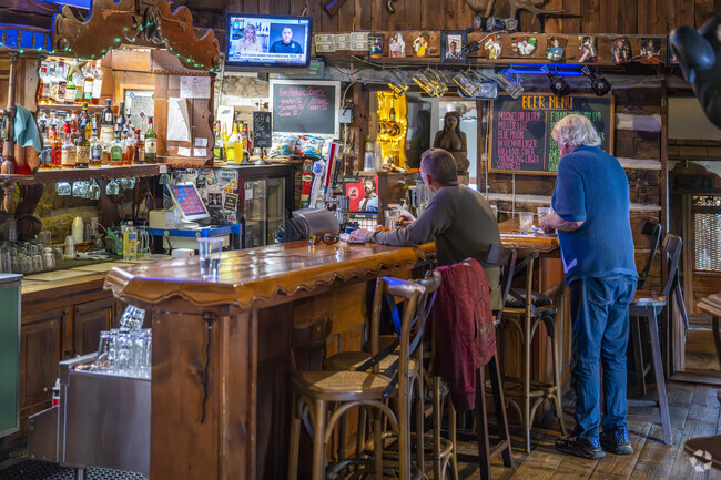 You can become a regular at the log cabin and watch sports at the bar with the owner.