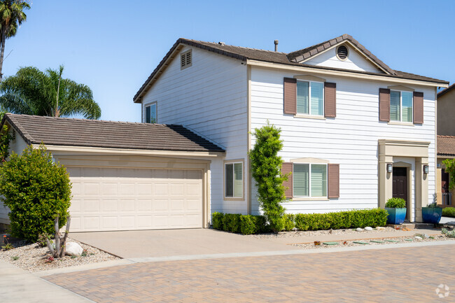 Find 2 story builds with attached garages in the Westside Costa Mesa residential area.